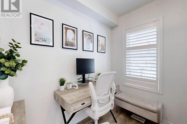 Modern home office with desk, computer, chair, artwork, bench, and window shutters - 55 Stocks Lane Aurora