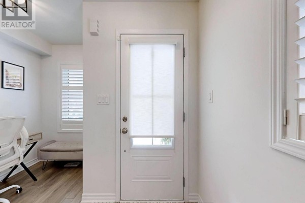 Interior hallway with white door, blinds, and desk - 55 Stocks Lane Aurora