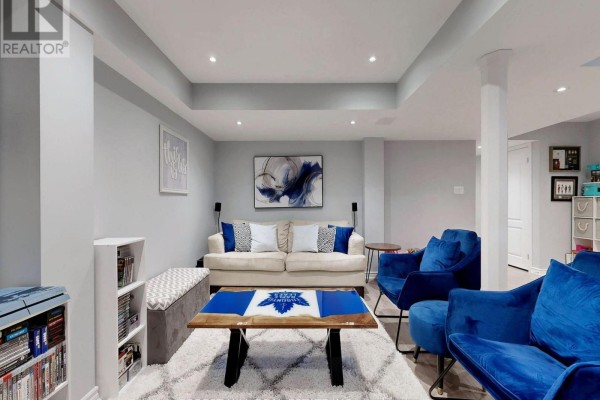 Living room with velvet armchairs, sectional sofa, and coffee table - 55 Stocks Lane Aurora