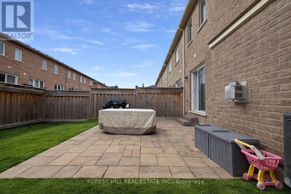 Paved patio with grill and storage - 55 Stocks Lane Aurora