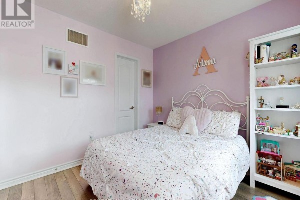 Bedroom with white metal bed, bookshelf, and purple walls - 55 Stocks Lane Aurora