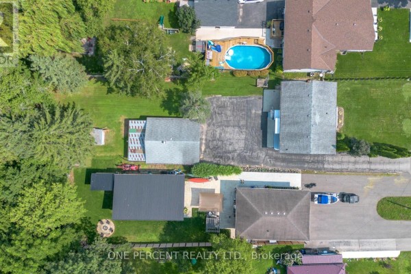Backyard with pool, deck, boat & fire pit - 55 Young Street Tillsonburg