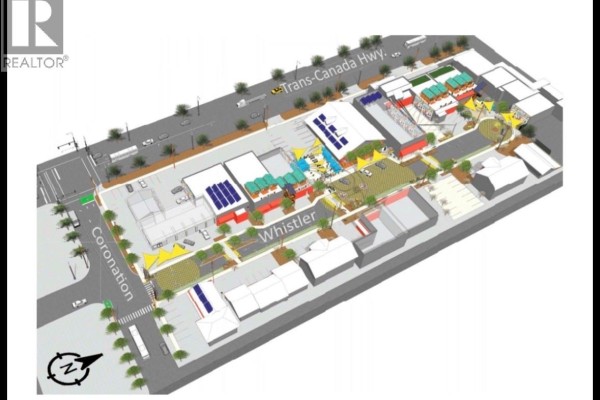Aerial view of commercial property layout with surrounding streets and landscaping - 555 Coronation Ave, Duncan