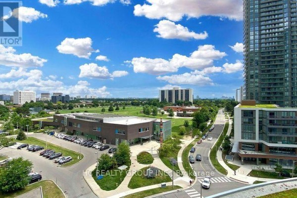 View from a high floor showing a park, school, and surrounding buildings. - 56 Forest Manor Road, Toronto