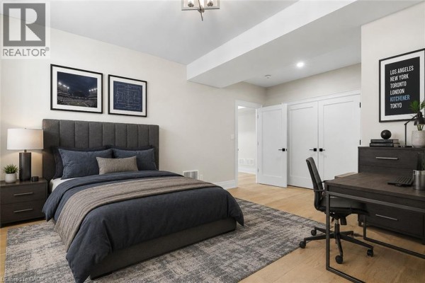 Bedroom with king bed, desk, and closet - 56 Pioneer Ridge Drive Kitchener