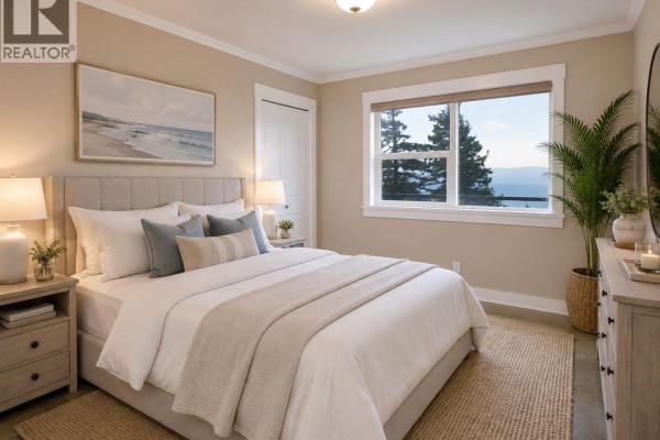 Bedroom with a king-size bed, blue accent pillows, and large windows with forest and water views. - 560 Wilderness Pl, Sooke