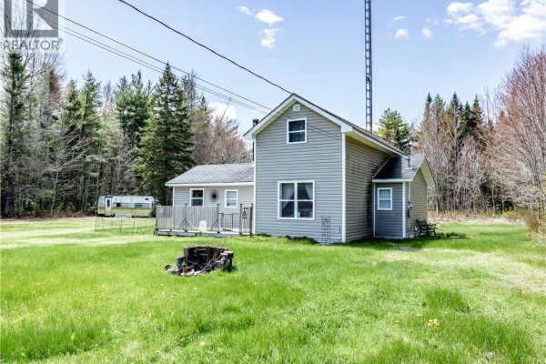 Backyard with wooden deck, fenced area, and snow-covered ground. - 561 Gray Road, Saint Charles