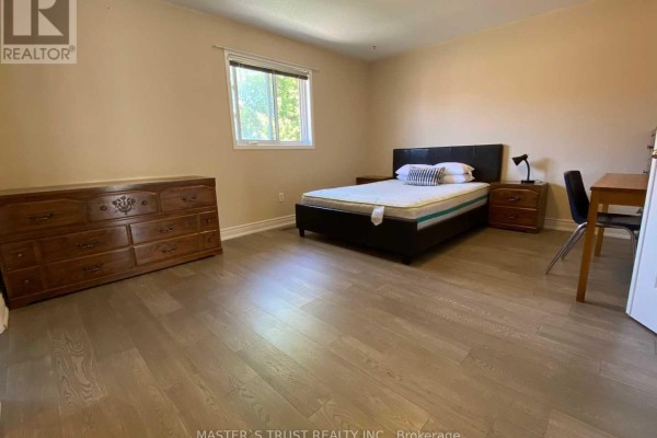 Bedroom with a queen-size bed, dresser, nightstand, and a desk. - 5659 Dolmite Heights, Mississauga