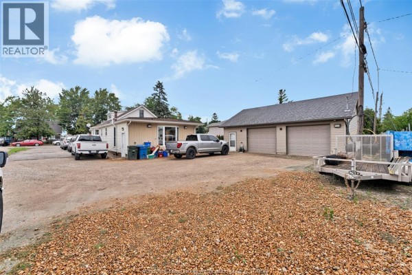 Detached garage, driveway, trucks, and trailers - 567 Edinborough Windsor
