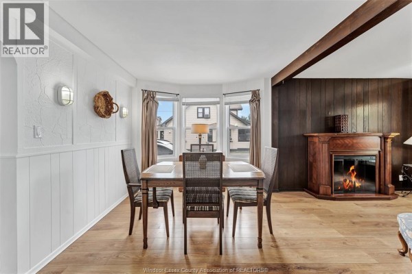 Dining room with table, chairs, and fireplace - 567 Edinborough Windsor