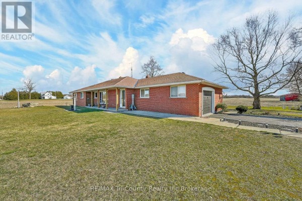 Brick ranch home with attached garage and covered porch - 568 7th Concession Enr Road Norfolk