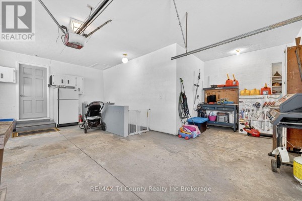 Garage with refrigerator, tool bench, grill & storage - 568 7th Concession Enr Road Norfolk