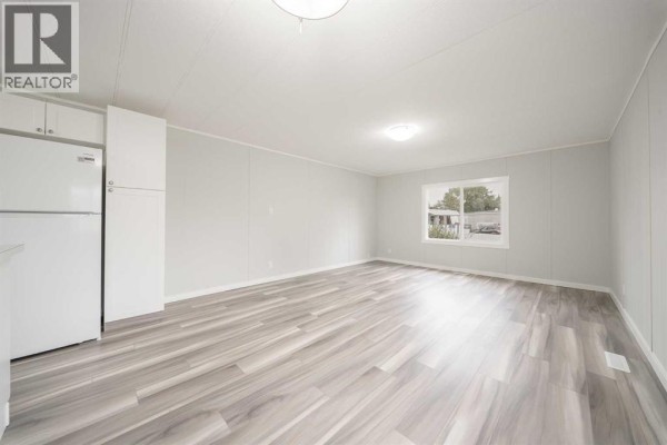 Living room - 57, 6220 17 Avenue, Calgary, AB T2A0W6 Photo 2