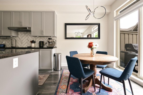 Kitchen with grey cabinets, stainless steel appliances, dark granite countertops, and a dishwasher. - 57 2738 158 Street, Surrey