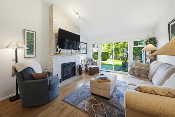 Interior foyer of a townhouse with a white door, closet, and light wood floor. - 57 8737 212 Street, Langley