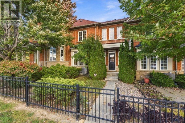 Front entrance with green door, sidelights, and brick facade. - 57 Barkdale Way, Whitby