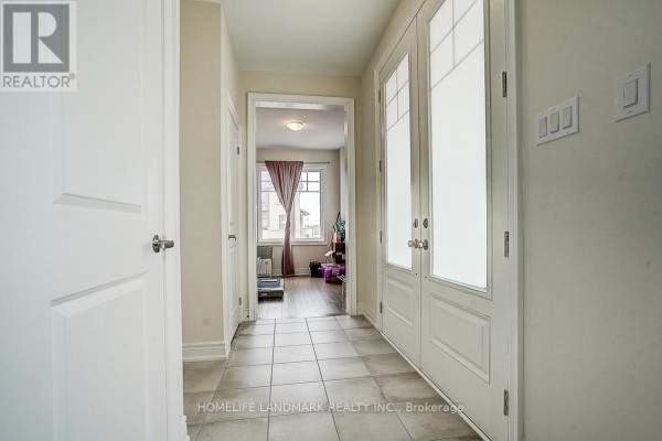 Dining area with dark table, chairs, and sliding glass doors to balcony. - 57 Faimira Avenue, Georgina
