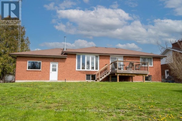 Exterior view of attached garage and detached garage beside brick house. - 57 Indian Trail, Kawartha Lakes
