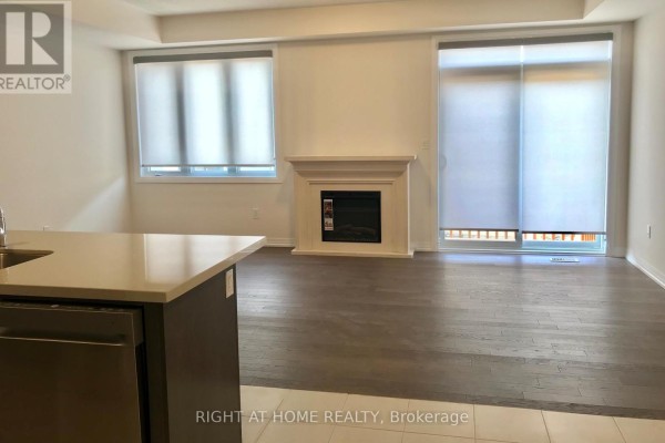 Living room with a white fireplace, dark hardwood floors, and large windows with blinds. - 58 Boiton Street, Richmond Hill