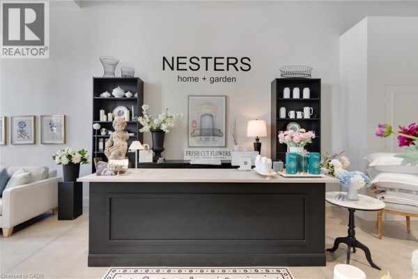 Retail counter with shelves, decorative items, and displays for home and garden products. - 58 S Grand Avenue Unit# 103, Cambridge