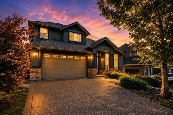 Front entrance with a bright blue door, stone accents, and white trim. - 5818 167a Street, Surrey