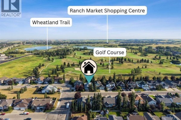 Aerial view of a residential neighborhood bordering a golf course, with labels pointing to a trail and shopping center. - 59 Hillview Road, Strathmore
