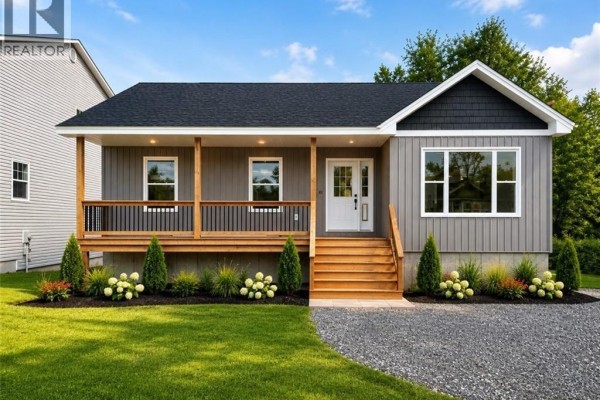 Front exterior of a grey bungalow with a wooden porch and steps under a bright blue sky. - 59 Malibu Street, Marysville
