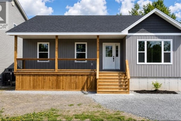 Close-up of the grey bungalow's wooden porch, steps, and front door. - 59 Malibu Street, Marysville