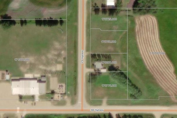 Aerial view showing numbered parcels of land, some with buildings and surrounding agricultural fields. - 592 Route Road, Inglis