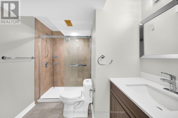 Glass-enclosed shower and modern vanity - 593 Pinawa Circle Ottawa