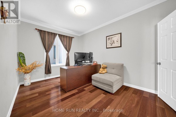 Office with desk, monitors, chair, and hardwood floors - 596 Anjana Circle Ottawa
