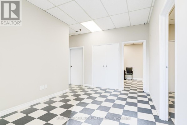 Another interior room with checkered flooring and closet space - 6 - 176 Rivermede Road, Vaughan