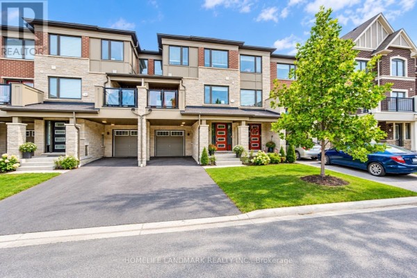 Exterior of a row of modern townhouses featuring stone, brick, and glass balconies. - 6 Sedgemoor Street, Whitby