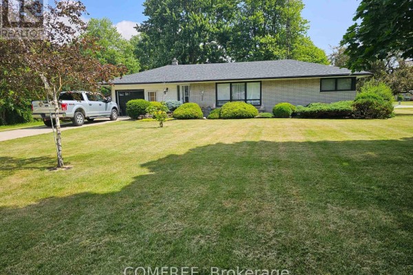 A residential home with light brick exterior, dark roof, and well-maintained landscaping. - 6 Sullivan Street, Chatham Kent