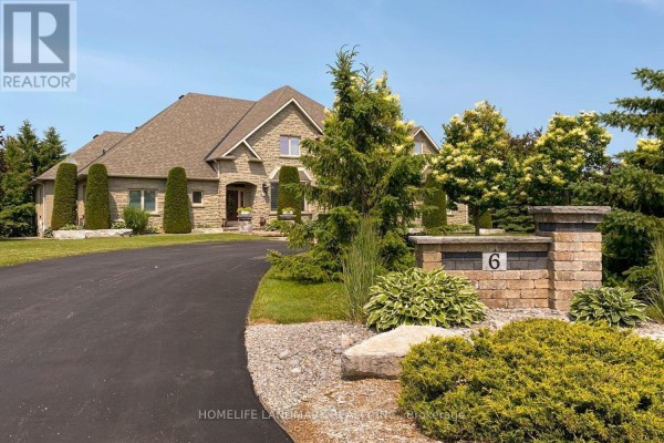 Aerial view of the property showcasing the pool and landscaped yard. - 6 Sunny Ridge Trail, Clarington