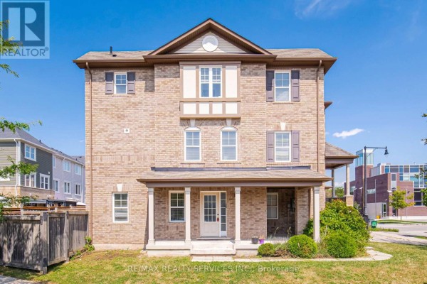 Front view of a light brown brick townhouse with a white porch and door. - 6 Viewforth Road, Brampton