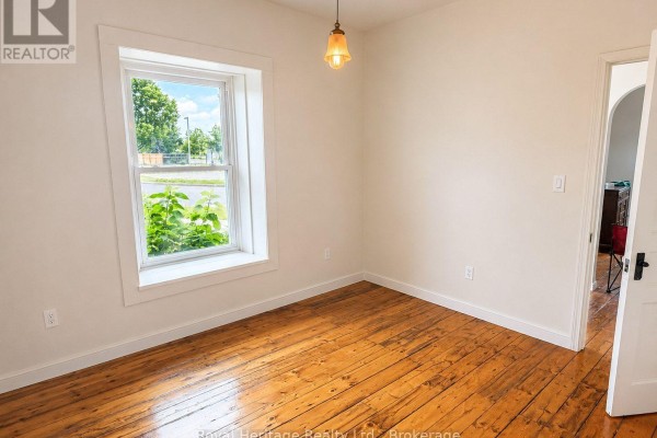 Empty room with hardwood floors and window - 6 Willard Street Belleville