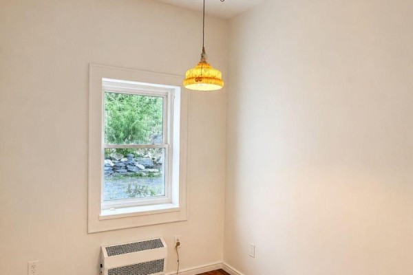Empty room with hardwood floors and a window - 6 Willard Street Belleville