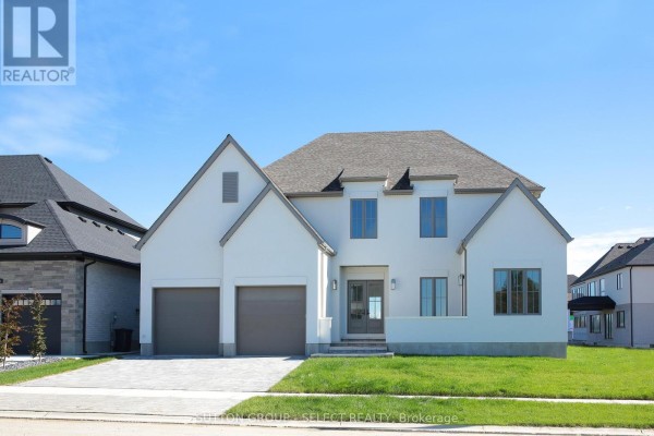 Another front view highlighting the architectural design and driveway. - 60 Bayshore Drive, Middlesex Centre