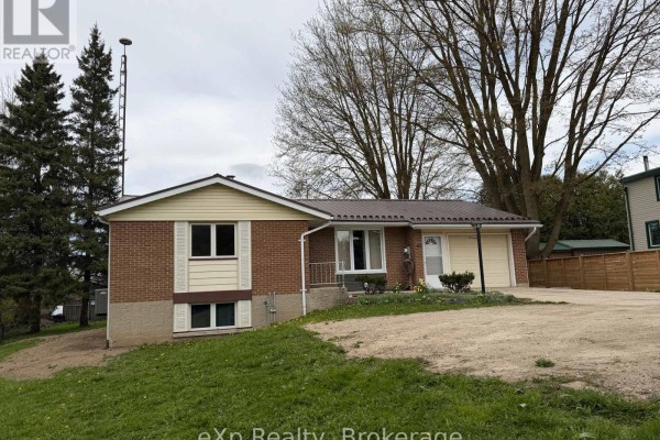 Mudroom with a bench, storage cabinet, and light gray walls. - 60 Main Street E, Mapleton