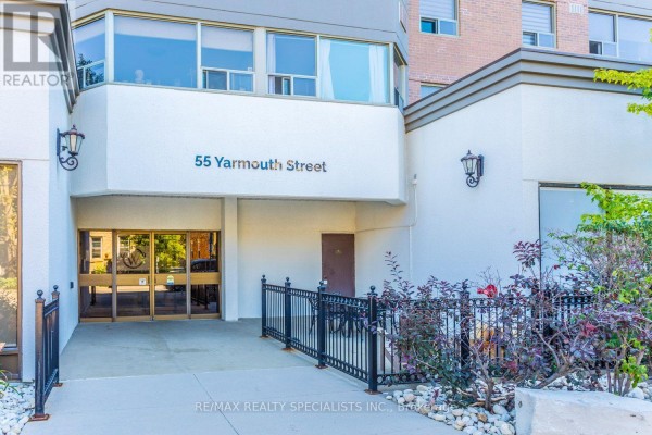 Entrance to 55 Yarmouth Street building with glass doors and a ramp. - 601 - 55 Yarmouth Street, Guelph