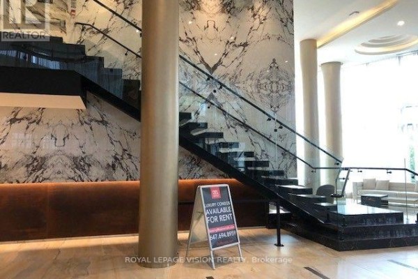 Dramatic staircase with black marble accents and a contemporary design. - 602 - 25 Adra Grado Way, Toronto
