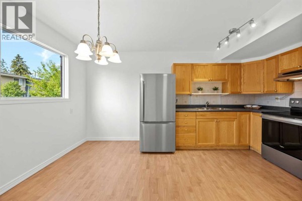 Living room - 605, 6223 31 Avenue Nw, Calgary, AB T3B3X2 Photo 4