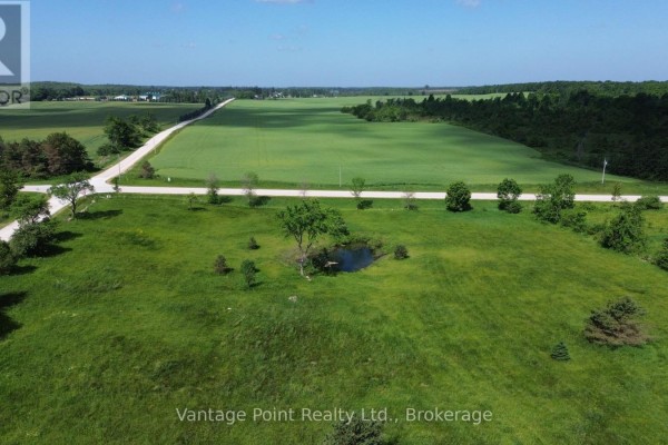 Expansive view of green fields and trees under a bright blue sky. - 605303 13a Side Road, Grey Highlands