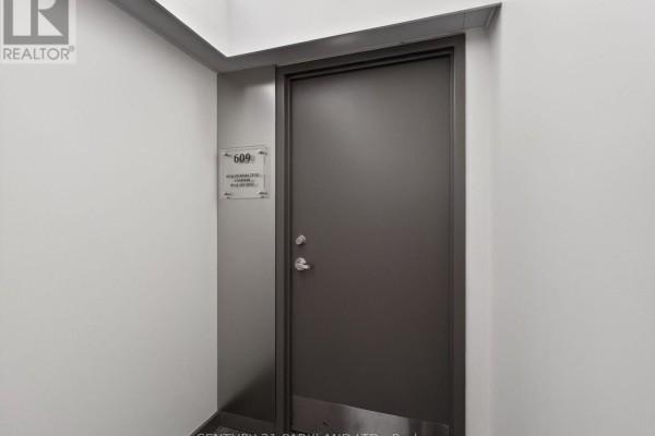 Entrance door to unit 609 with signage - 609 - 220 Duncan Mill Road, Toronto