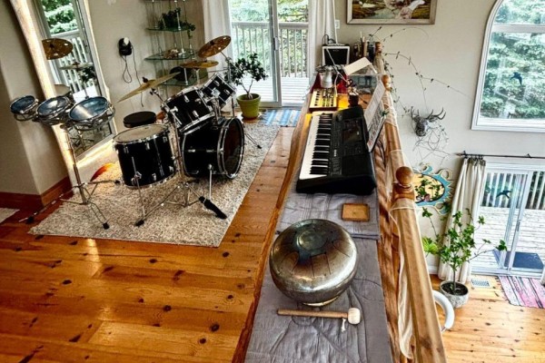 Loft area with a drum kit, keyboard, and tongue drum overlooking the main floor. - 61 Constance Blvd. Boulevard N, Wasaga Beach