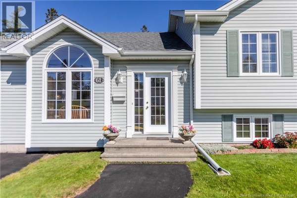 Close-up of the front entrance of a light blue house with double glass doors. - 61 Fawcett Avenue, Sackville