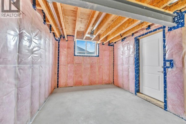 Unfinished basement with insulation and exposed joists - 61 Hilton Court Amherstburg
