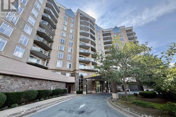 Exterior view of The Roxbury condo building with balconies and arched windows. - 610 202 Walter Havill Drive, Halifax