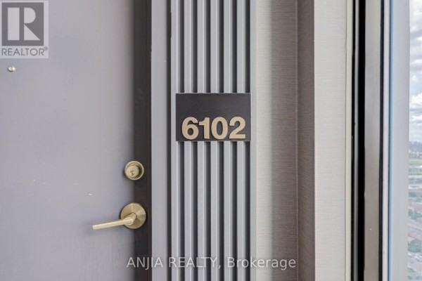 Apartment door with number "6102" and brass handle. - 6102 - 5 Buttermill Avenue, Vaughan